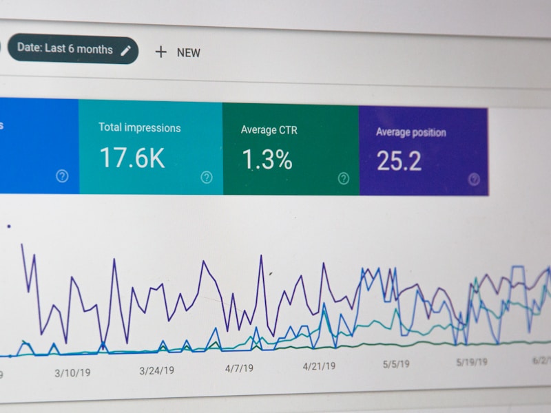 View overlooking water with a palm tree and benches